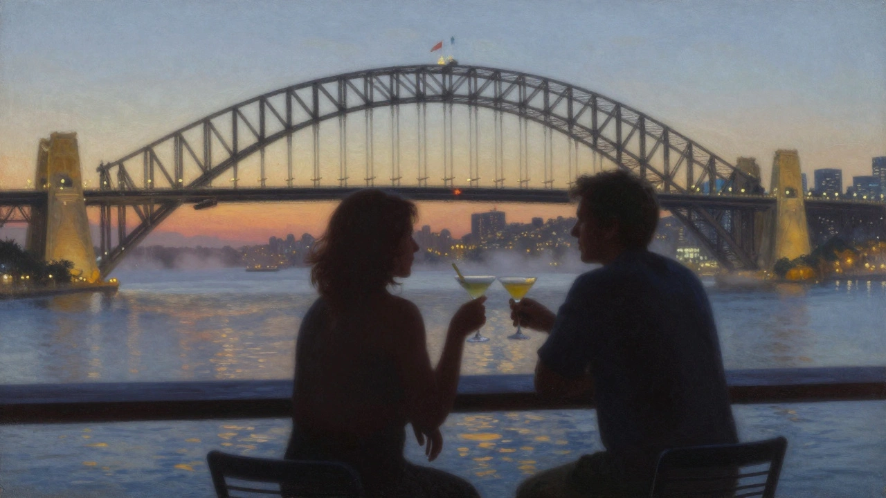 Silhouetted couple sharing a drink on a rooftop as the harbor and bridge glow at dusk.