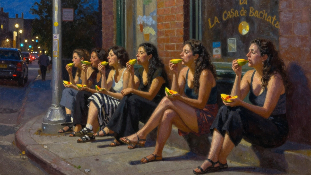 Group of women sharing fruit on a curb after dancing, smiling, streetlamp glow, rhythm still in their bones.