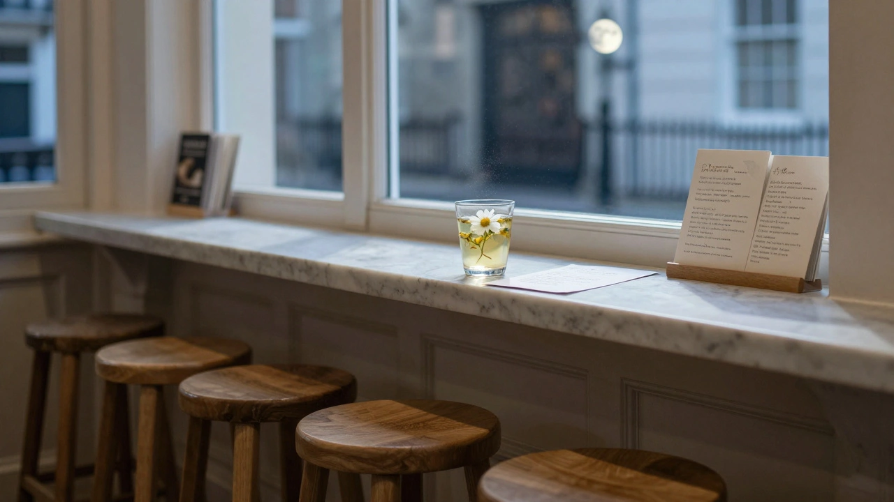 A single chilled herbal tea drink with a floating flower, served in quiet, moonlit bookshop surroundings.