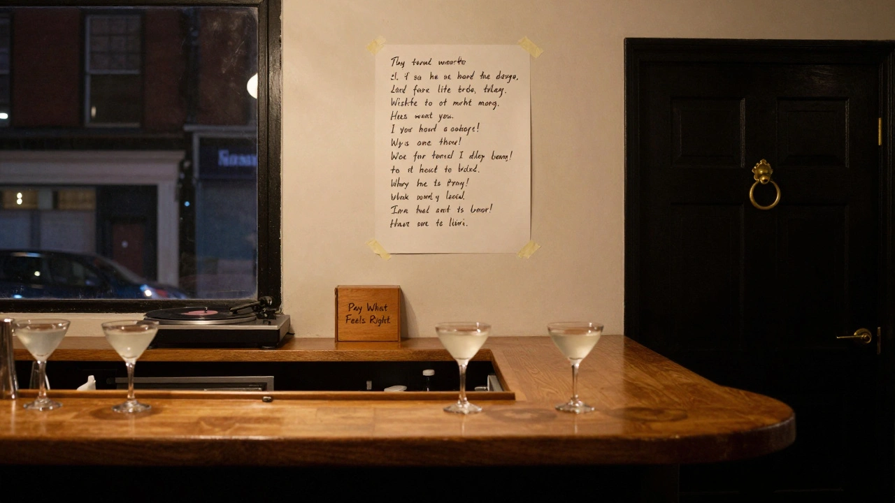 An empty bar counter at night with a handwritten poem on the wall and a wooden donation box beside it.